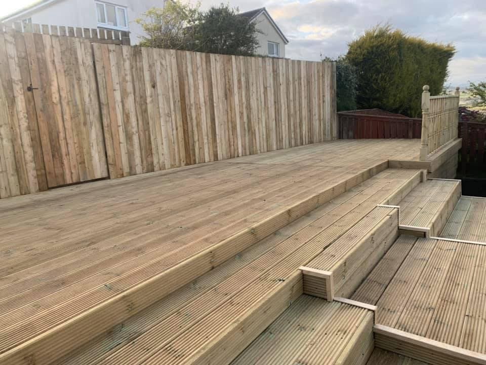 Timber fencing and decking installation in residential garden