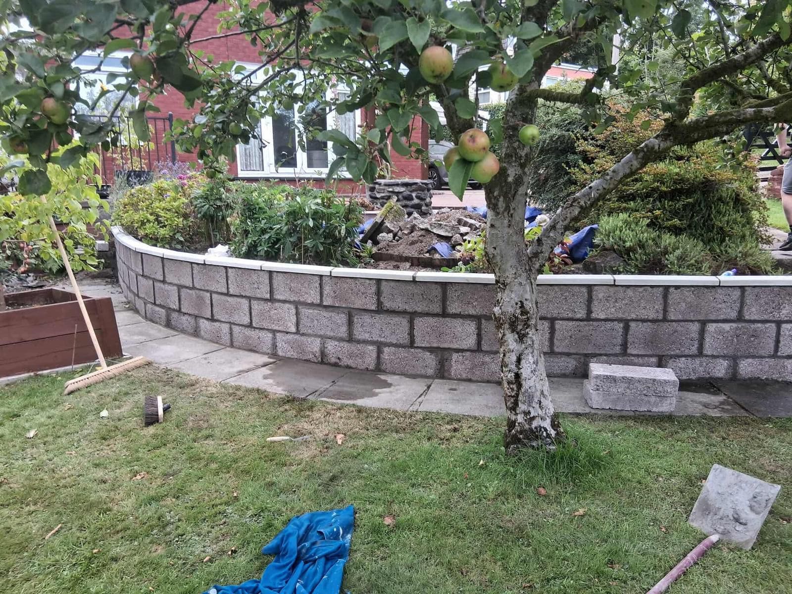 Block retaining wall construction in sloped Glasgow garden